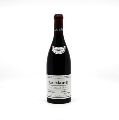 bottle of red wine sitting on a white surface with a white background