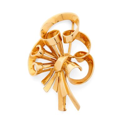 une image représentant une broche plaquée or ornée d'un motif floral