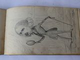 an open book with a drawing of a skeleton holding a tennis racquet