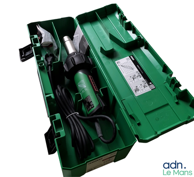 une image représentant une boîte à outils verte contenant des outils