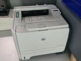 a printer that is sitting in front of a window