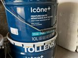 three buckets of toilet paint sitting next to each other