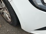 a close up of a car ' s headlight and front bumper