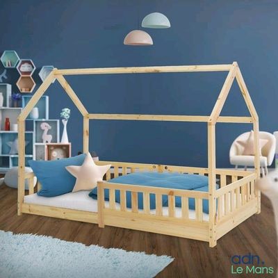 a picture of a kid ' s room with a bed and a couch