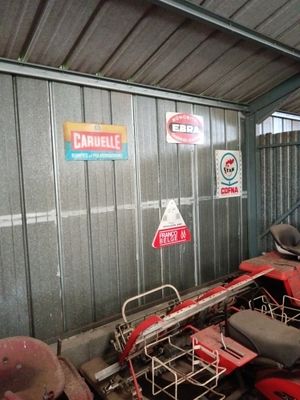 many motorcycles that are parked inside of a building