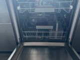 a dishwasher in the middle of a kitchen