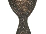 an image of a metal spoon with a decorative design on it