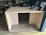 a wooden desk with a mirror on top of it