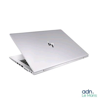 a laptop that is open on a white surface