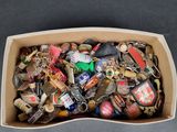 a cardboard box filled with assorted keys on a table