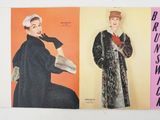 an old fashion magazine with two women wearing coats and hats