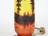 a lamp that has a picture of a sunset on it