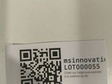 a qr code on the back of a toilet seat