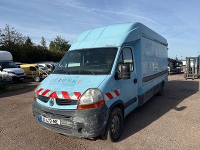 a blue van that is parked in a parking lot