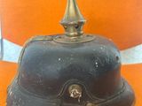 a black helmet sitting on an orange chair