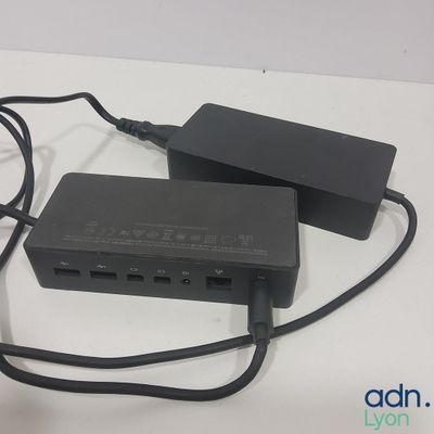 a black charger sitting on top of a table next to a charger