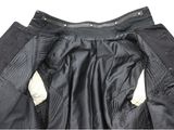the back of a pair of black pants with a zipper down the side