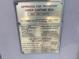 a sign on the back of a vehicle stating that it is under customs seal