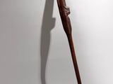 an image of a wooden stick on a white wall