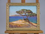 an oil painting of a tree sitting on top of a wooden easel