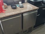 an image of a kitchen counter with a phone on top of it