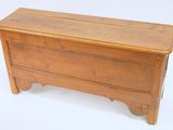 a small wooden chest on a white background