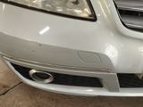 a close up of a car ' s front bumper and grille