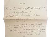 un vieux morceau de papier avec une écriture dessus, posé sur une table