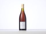 a bottle of wine sitting on top of a table