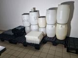 a stack of plastic containers and containers on a pallet