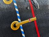 an image of a close up of a jacket with buttons
