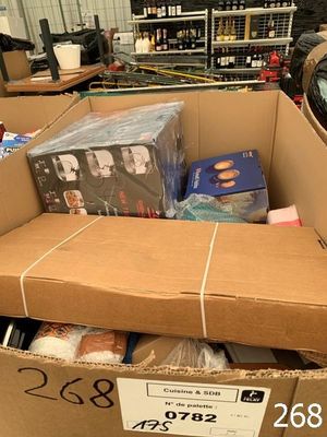 a cardboard box full of cds and cds in a store