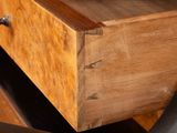 a wooden desk with a drawer on top of it