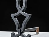 a sculpture of a man sitting on a bench