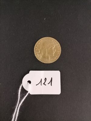 a close up of a coin with a tag attached to it