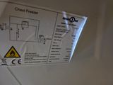 a close up of a sign on the side of a refrigerator