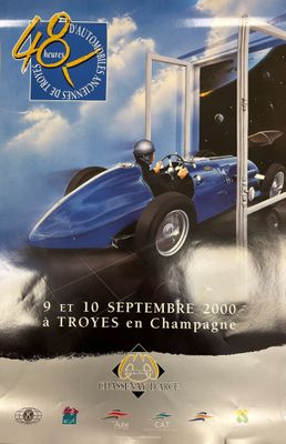 a poster of a race car on display in a store