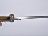 a person holding a knife in their right hand