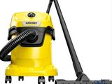 a yellow vacuum cleaner with a black hose on a white background