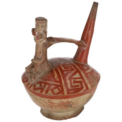 Vase à anse-pont et goulot oblique, surmonté d’un personnage…