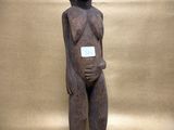 a close up of a statue of a person with a tag on it ' s chest
