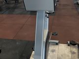an image of a gym room with a tread machine and other equipment
