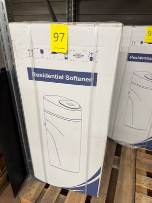 two boxes of toilet paper are stacked on pallets in a store
