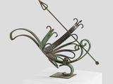 an image of a sculpture of a butterfly with a bow on top of it