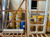 a pallet full of paint and other items in a room