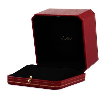 a close up of a red box with a ring inside of it