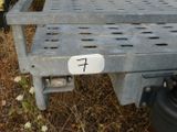 a truck with a number 7 on it parked in the grass