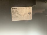 an image of a refrigerator with a price label on it