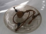a glass plate with a rope and a wooden object on it