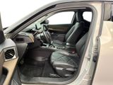 the interior of a car with the door open and the driver ' s seat down
